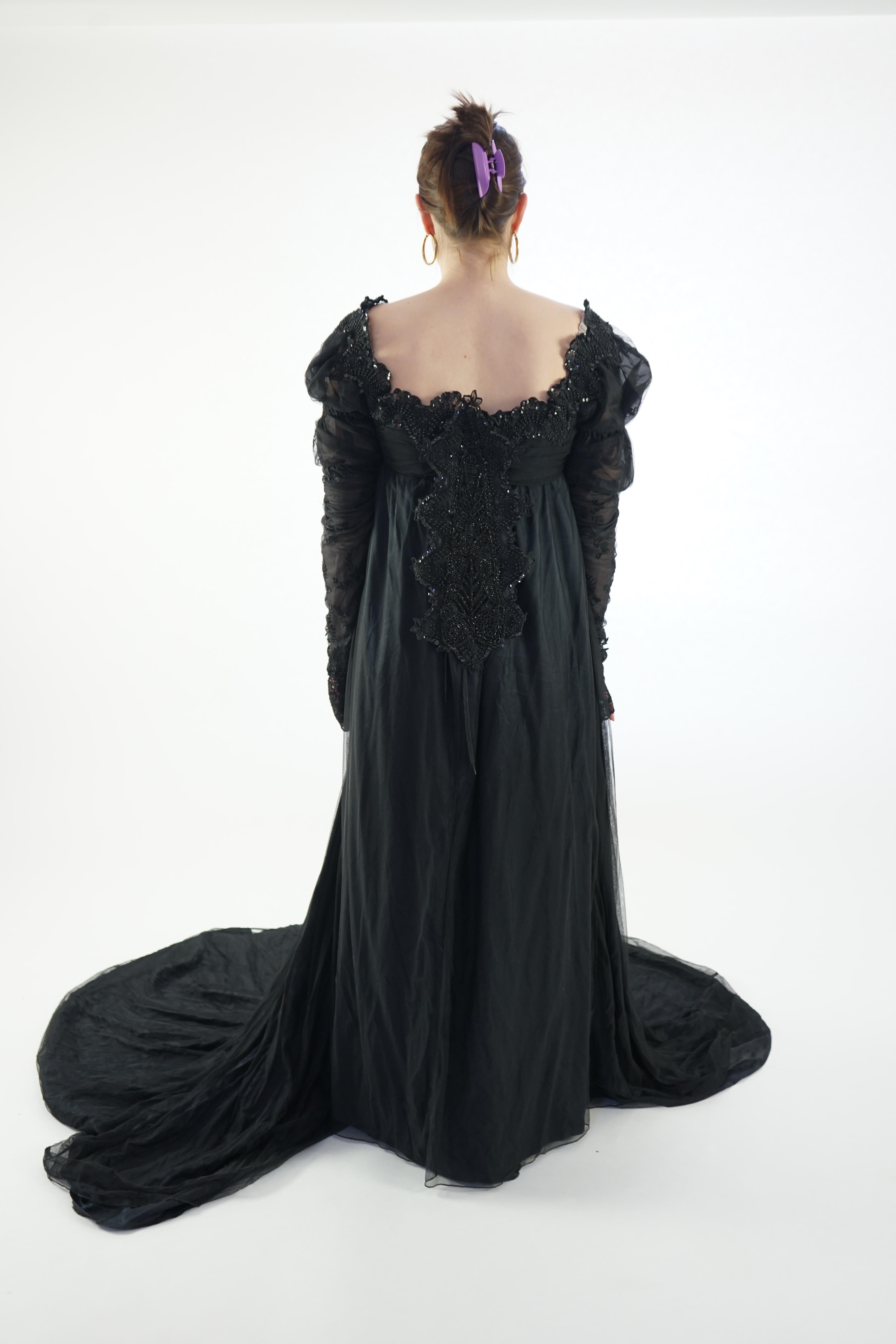 A fine quality lady's black satin, chiffon and jet trimmed Regency style evening dress with long train, lacing on jet stomacher. Ex English National Opera (unlabelled) 'Don Giovanni'